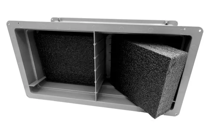 Rectangular foam-filled enclosure with a divider and removable foam block.