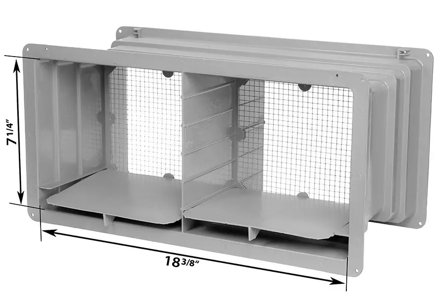 A metal mesh incubator with compartments and a measuring scale.