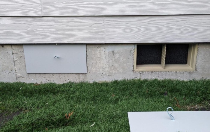 a house with vent covers.